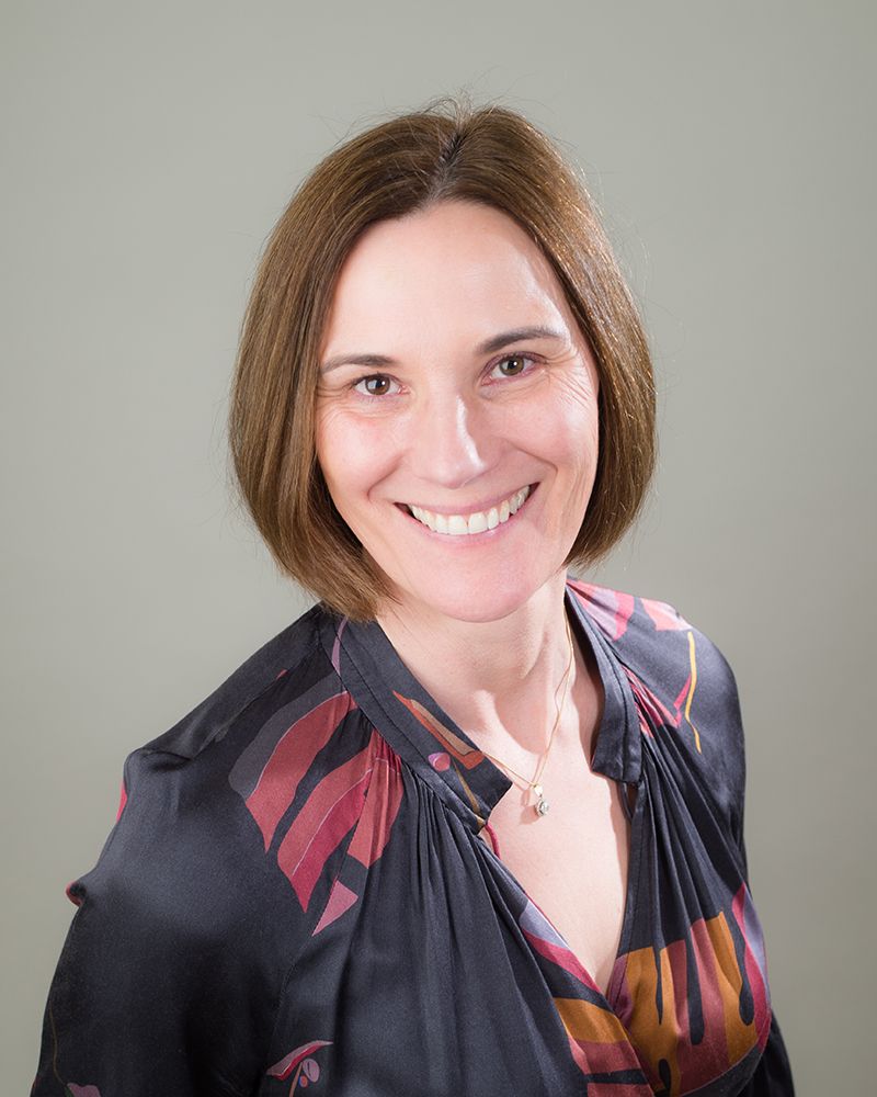 A headshot of a woman with short hair wearing a black and red shirt, photographed by Abigail's Studio in High Wycombe.