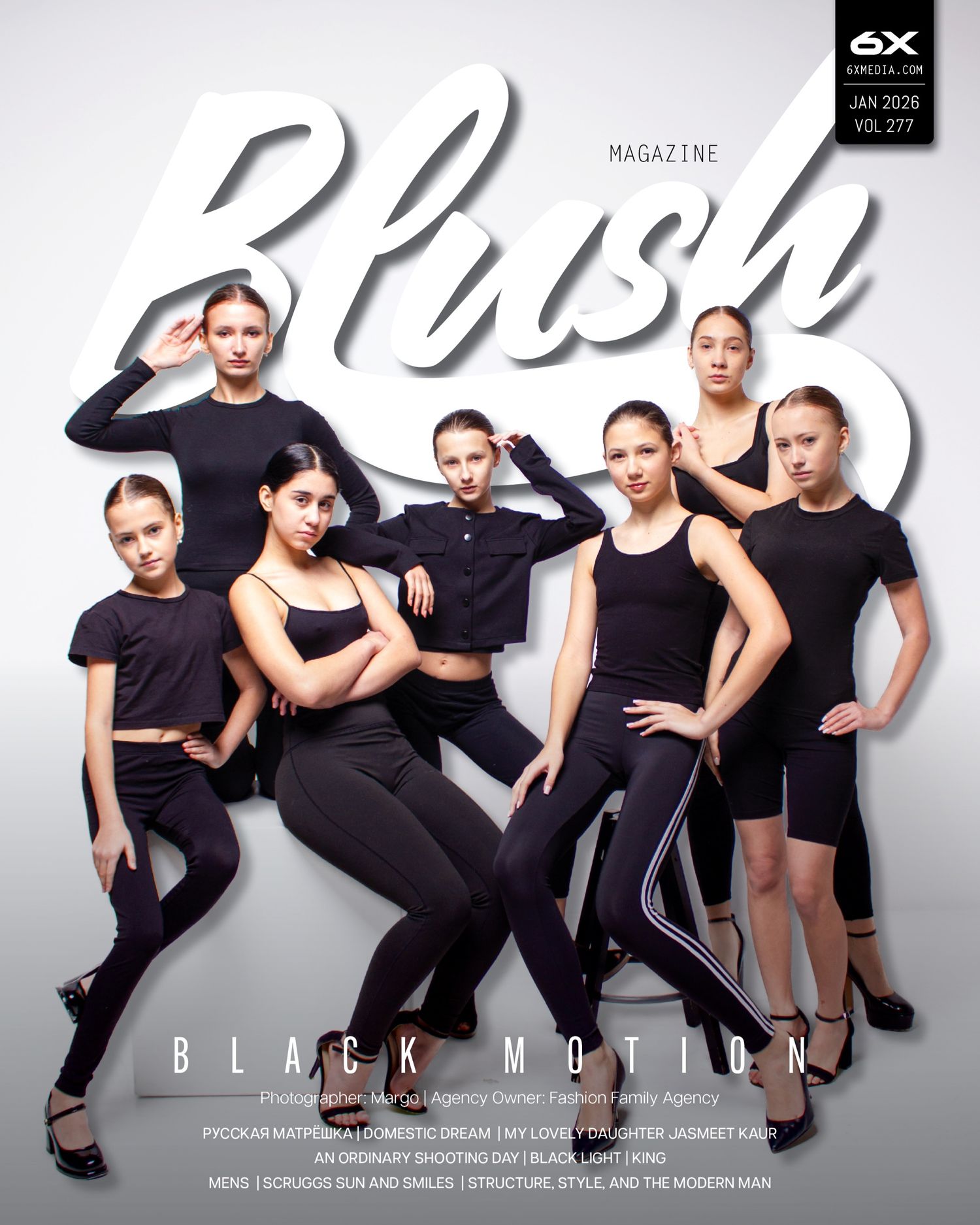 Dance group in black outfits poses together in dynamic formation against white background for magazine cover.