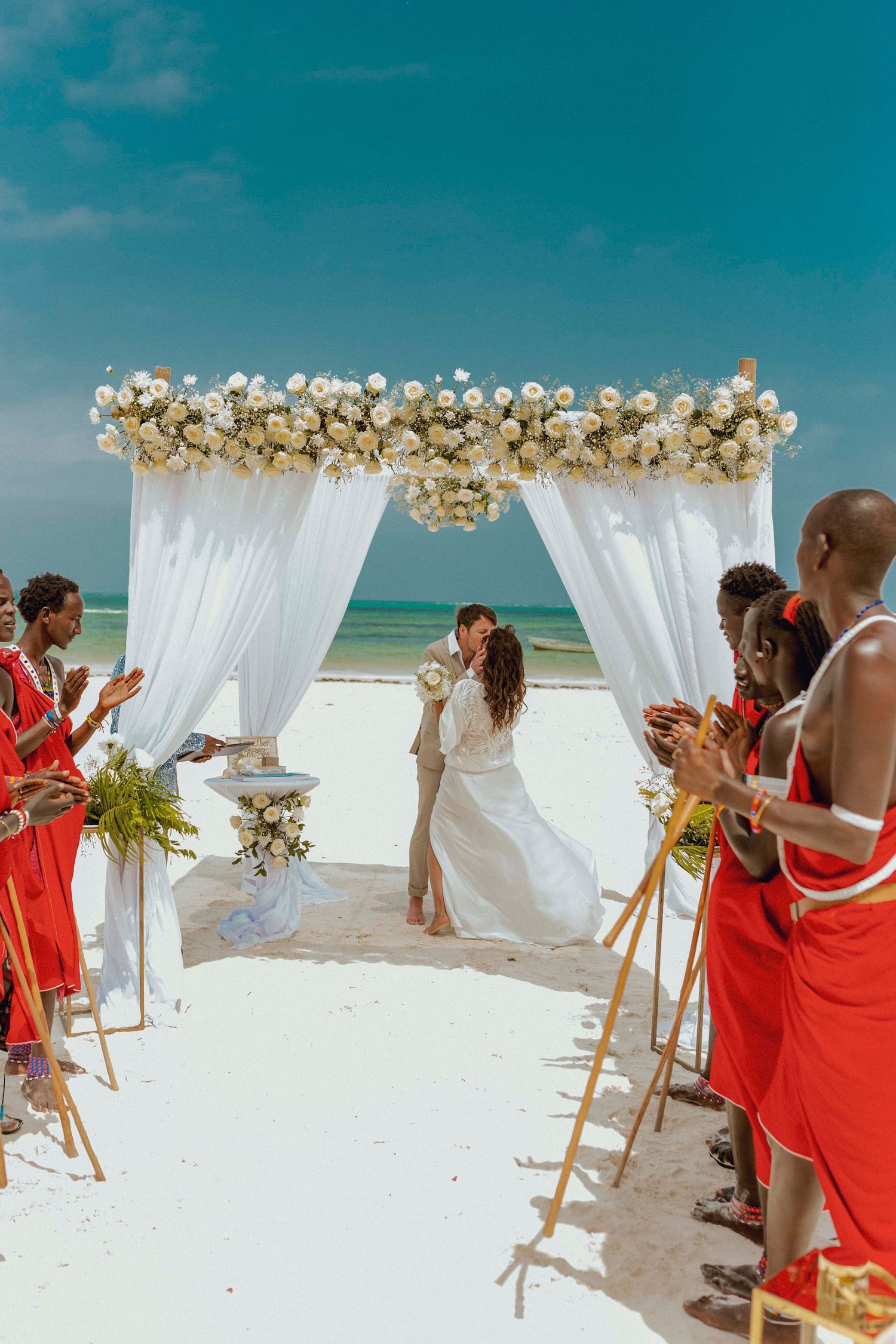 Romantic beach wedding couple portrait in Zanzibar with ocean background