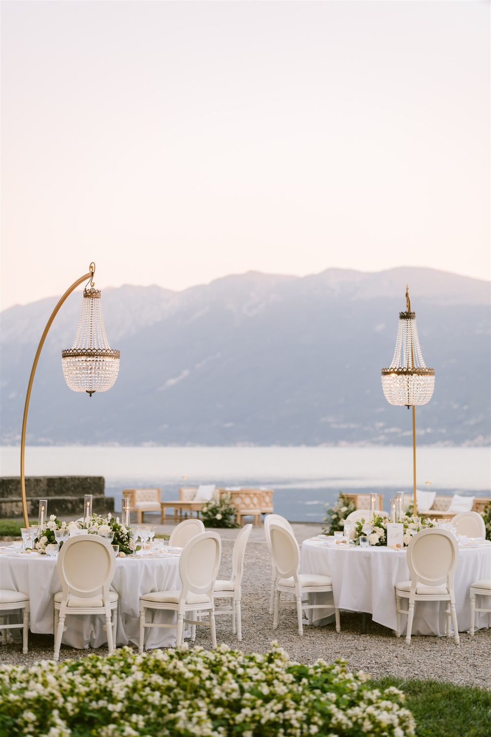 Elegant wedding reception setup in the lakefront garden of Villa Bettoni