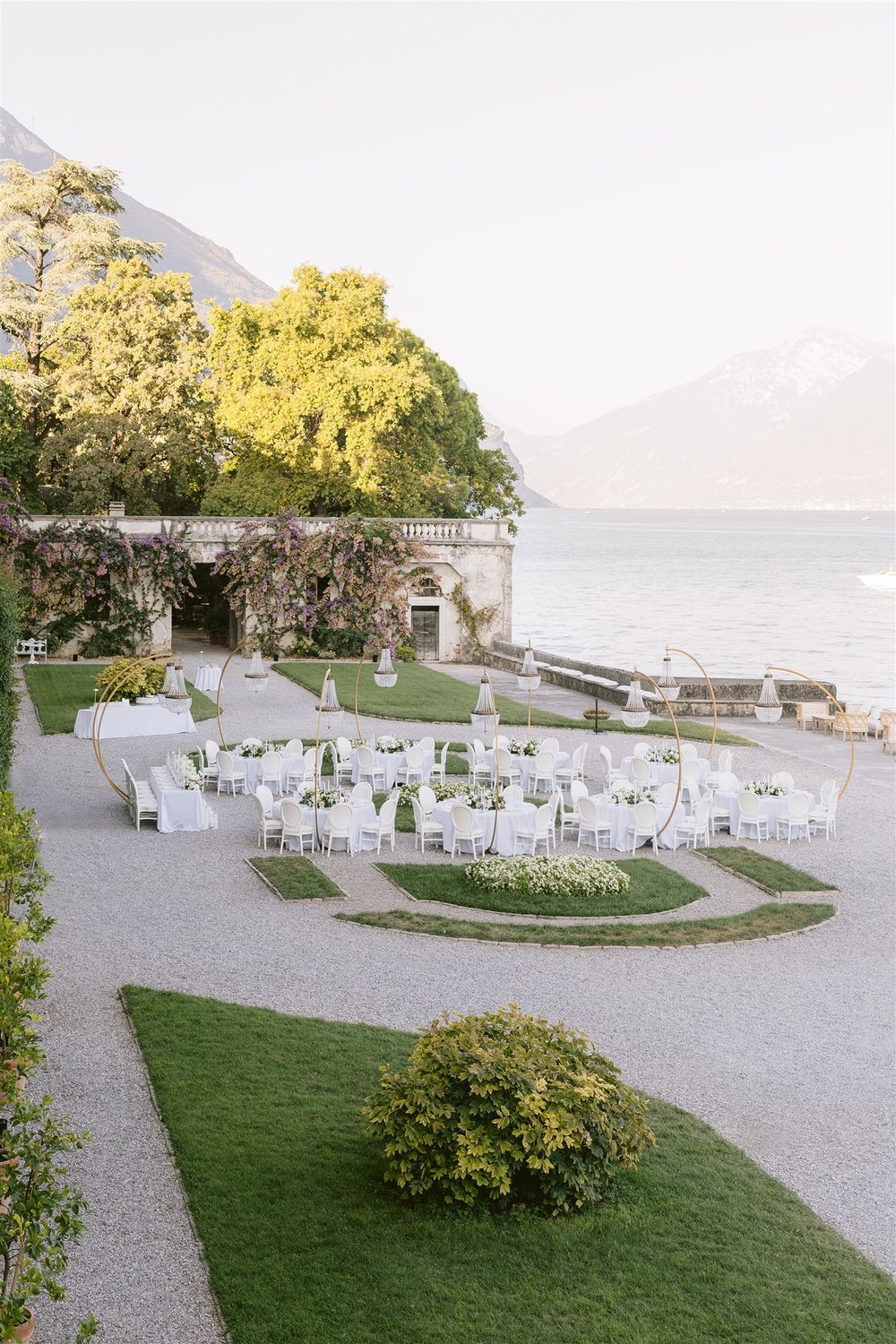 Elegant wedding reception setup in the lakefront garden of Villa Bettoni