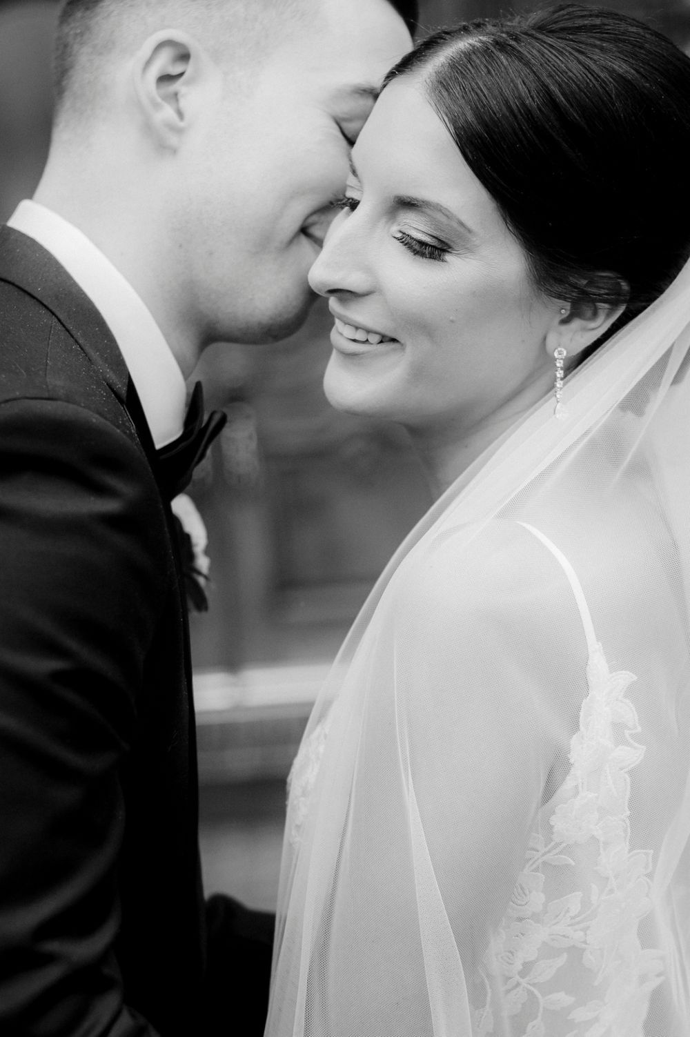 Black and white wedding photo sequence showing tender romantic moments between bride and groom with veil detail.