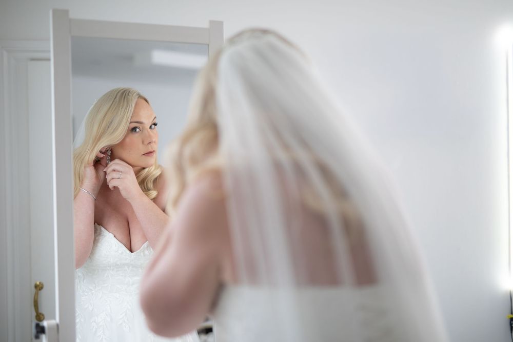 Artistic black and white shots of wedding preparation moments in a bright interior setting.