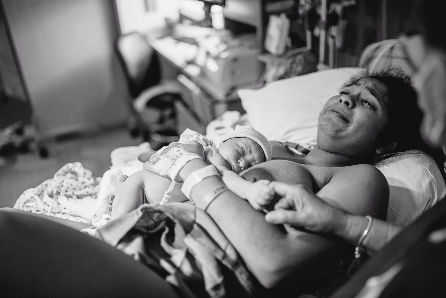 A series of black and white photos showing someone resting on a hospital bed during medical treatment.