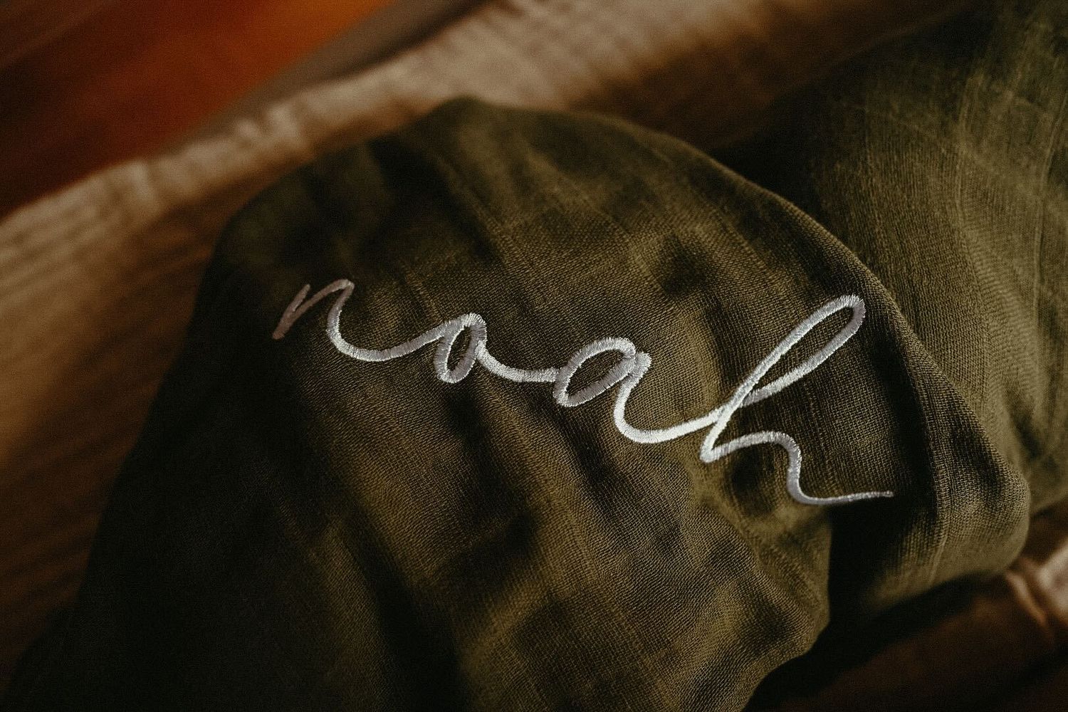 Close up detail of dark fabric with light text.