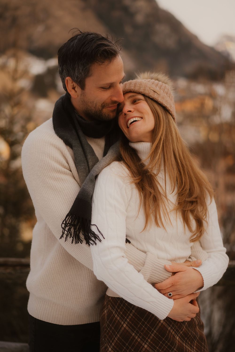 Candid and emotional look between a bride and groom-to-be in the heart of the Alps.