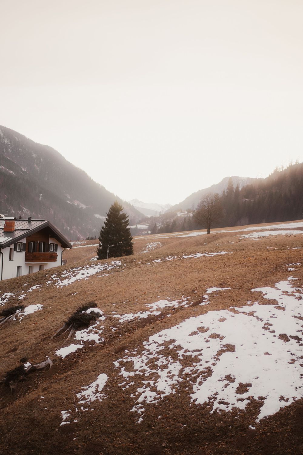 Wind-blown hair and genuine smiles, outdoor engagement session inspiration in the Dolomites.
