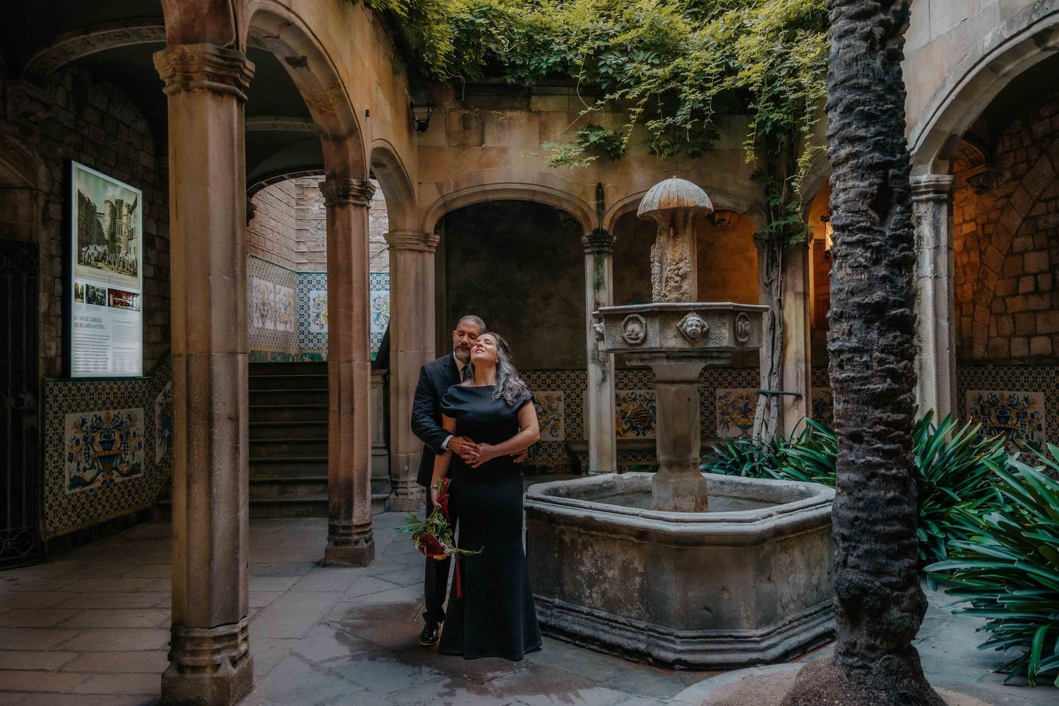 Sunlight filtering through narrow alleys on a happy couple.
