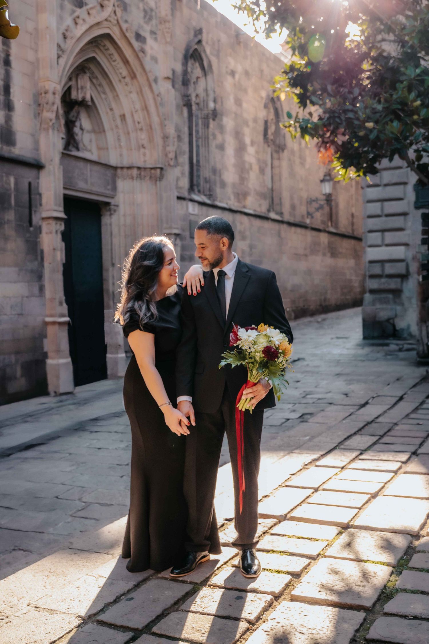 Romantic anniversary photos with historic Roman walls background.