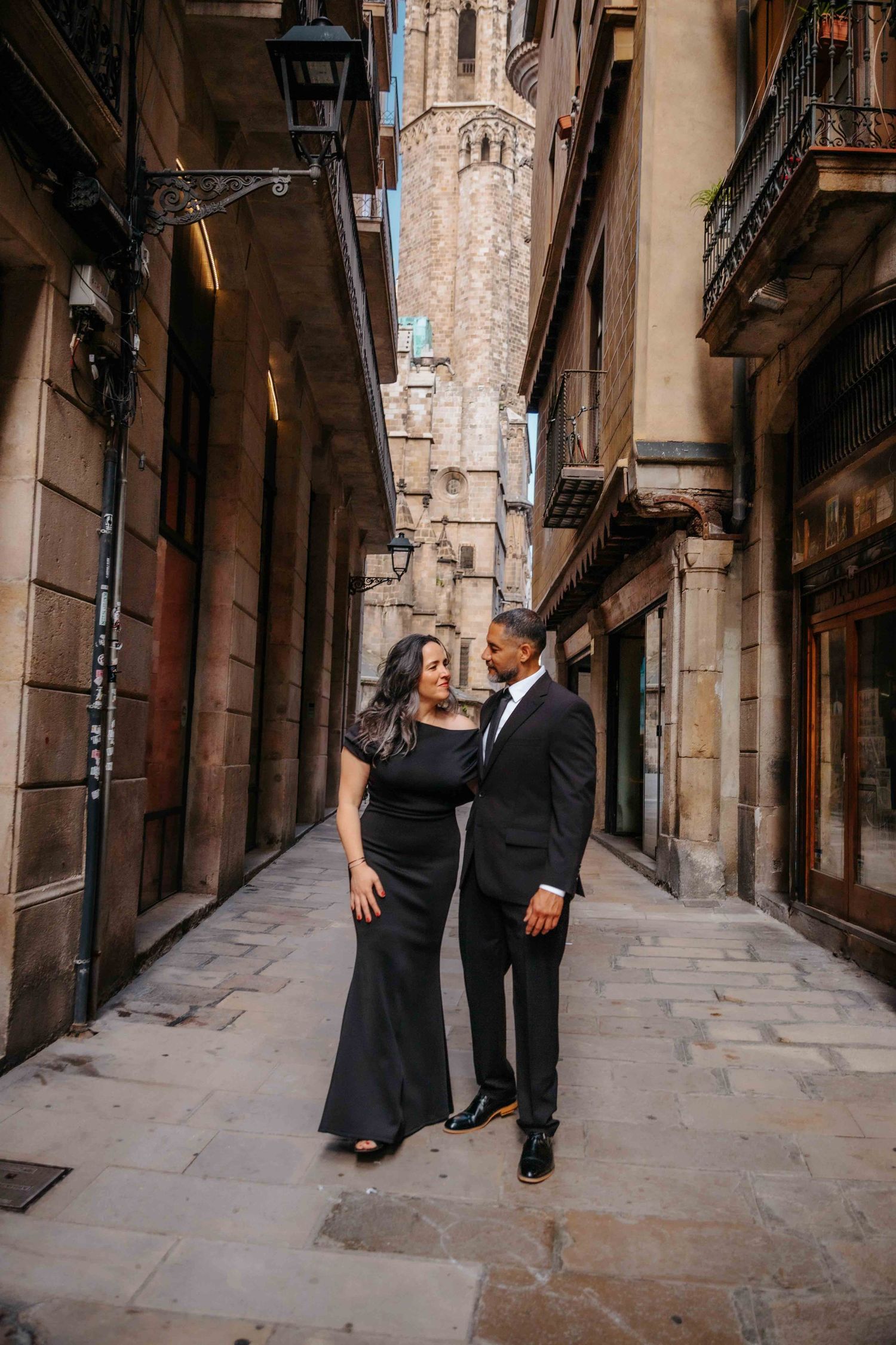 Joyful couple celebrating 20th wedding anniversary with a photoshoot in Spain.
