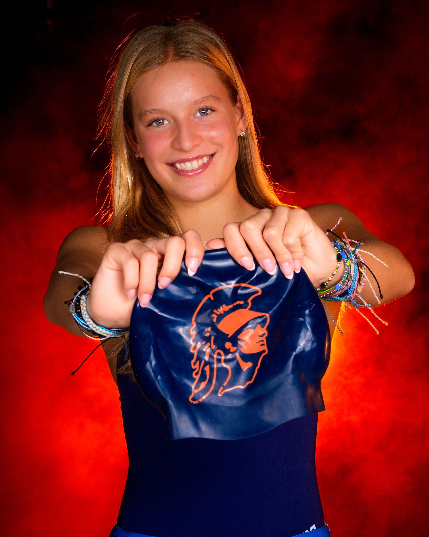 Hershey High School Trojan swimming media day with orange fog background, by SportsFox Photography, Hershey PA