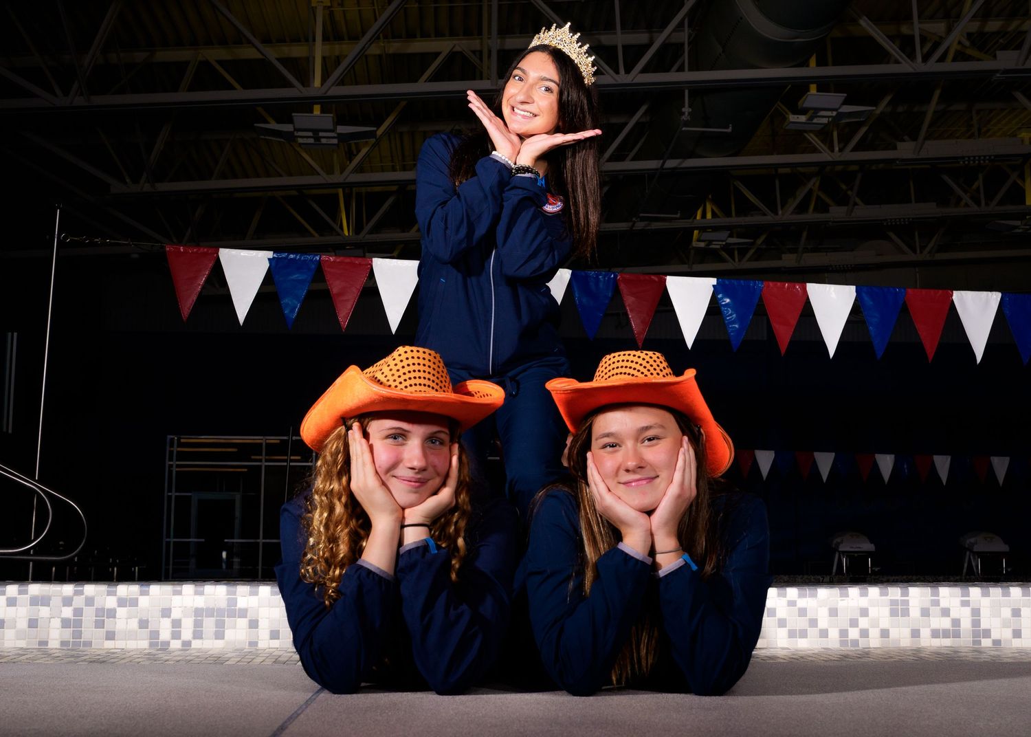 Hershey High School Trojan swimming media day with orange fog background, by SportsFox Photography, Hershey PA