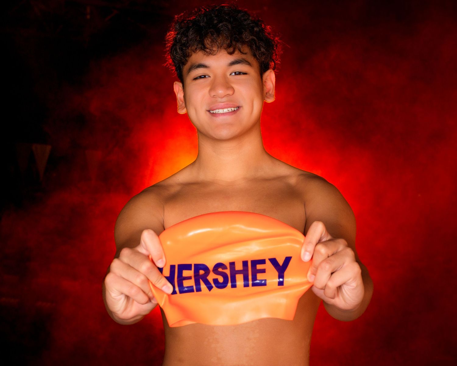 Hershey High School Trojan swimming media day with orange fog background, by SportsFox Photography, Hershey PA