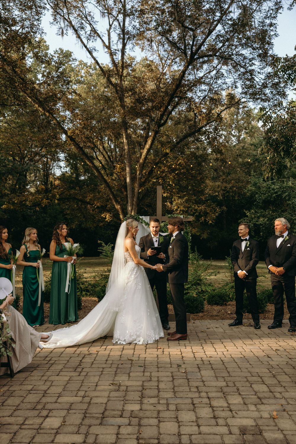 Emotional wedding ceremony surrounded by friends and family at The Elms of Coosada in Coosada, Alabama