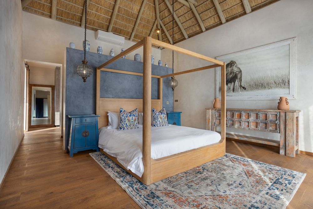 Elegant master bedroom with en-suite bathroom and balcony view