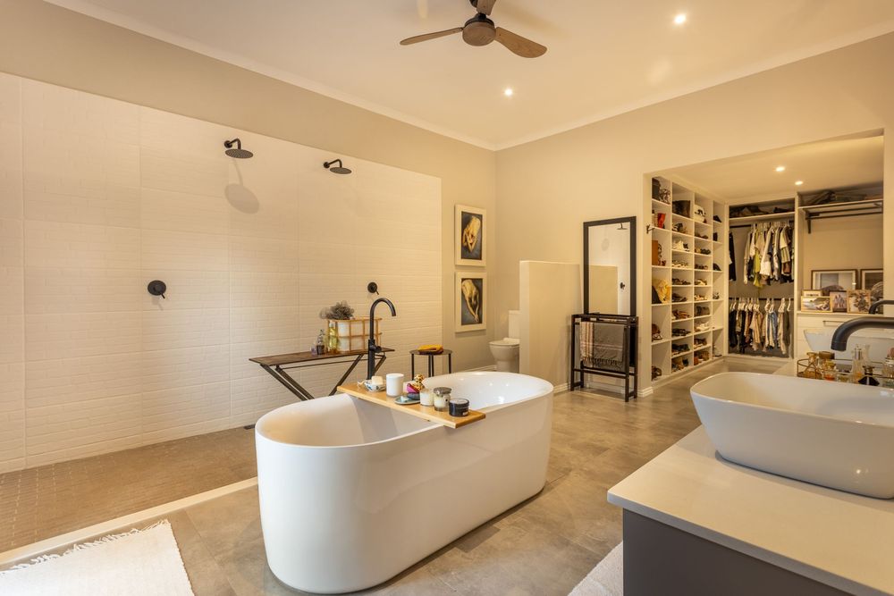 Luxury bathroom with freestanding tub, walk-in shower, and double vanity