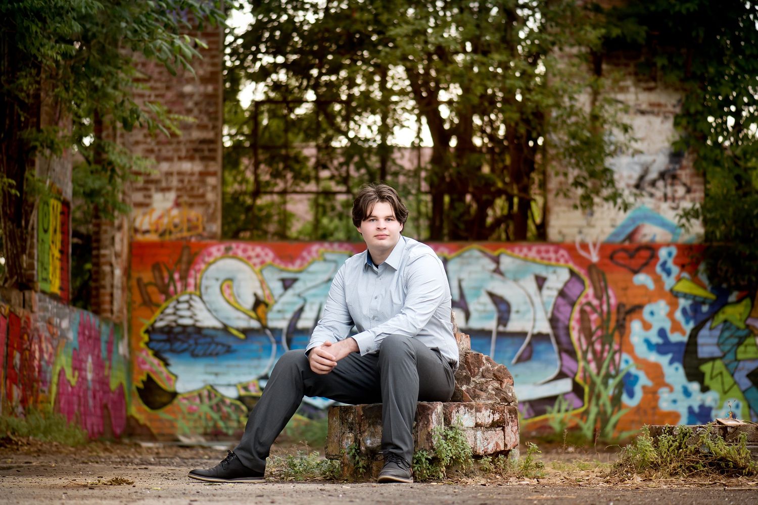 Urban graffiti art decorates brick walls in an outdoor setting.