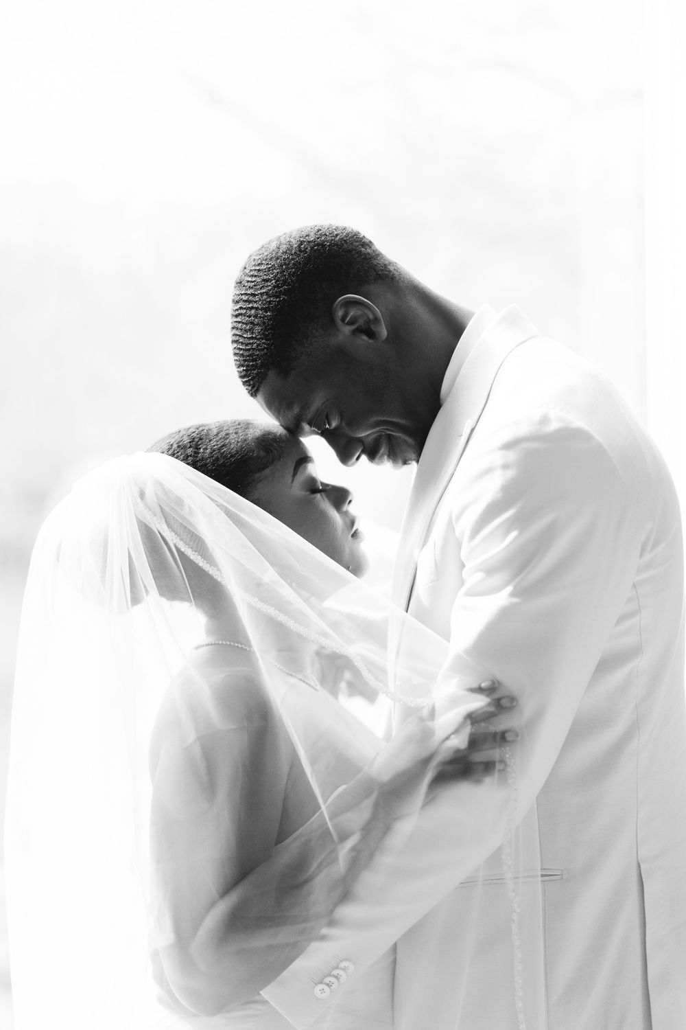 Intimate black and white photo sequence showing tender emotional moments.