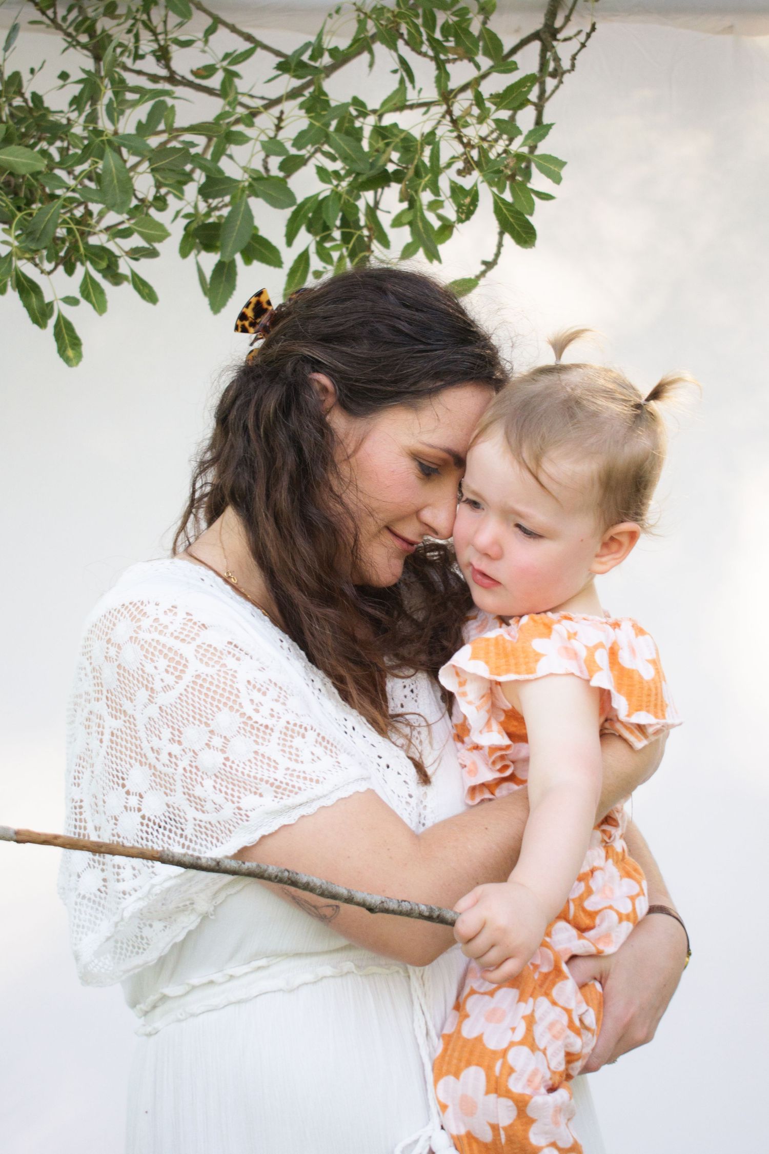 Newcastle motherhood photography of a mother holding her toddler in outdoor session