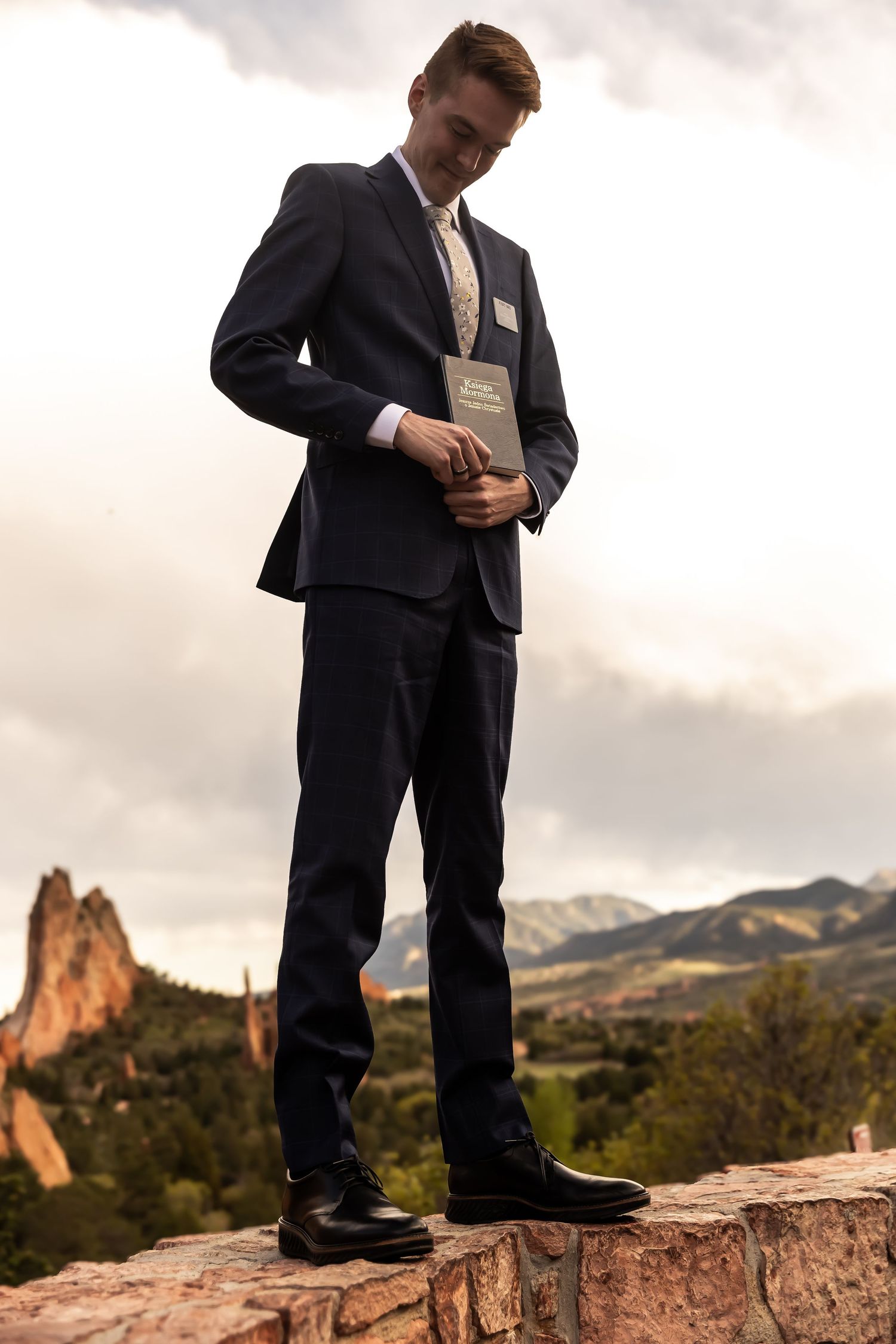 Young LDS missionary holding Book of Mormon, photographed by Indiana photographer.