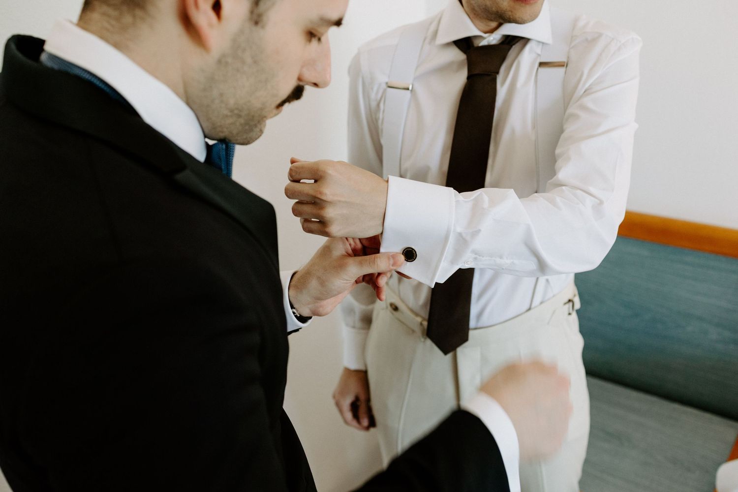 Two people in white lab coats examining documents in a medical setting.