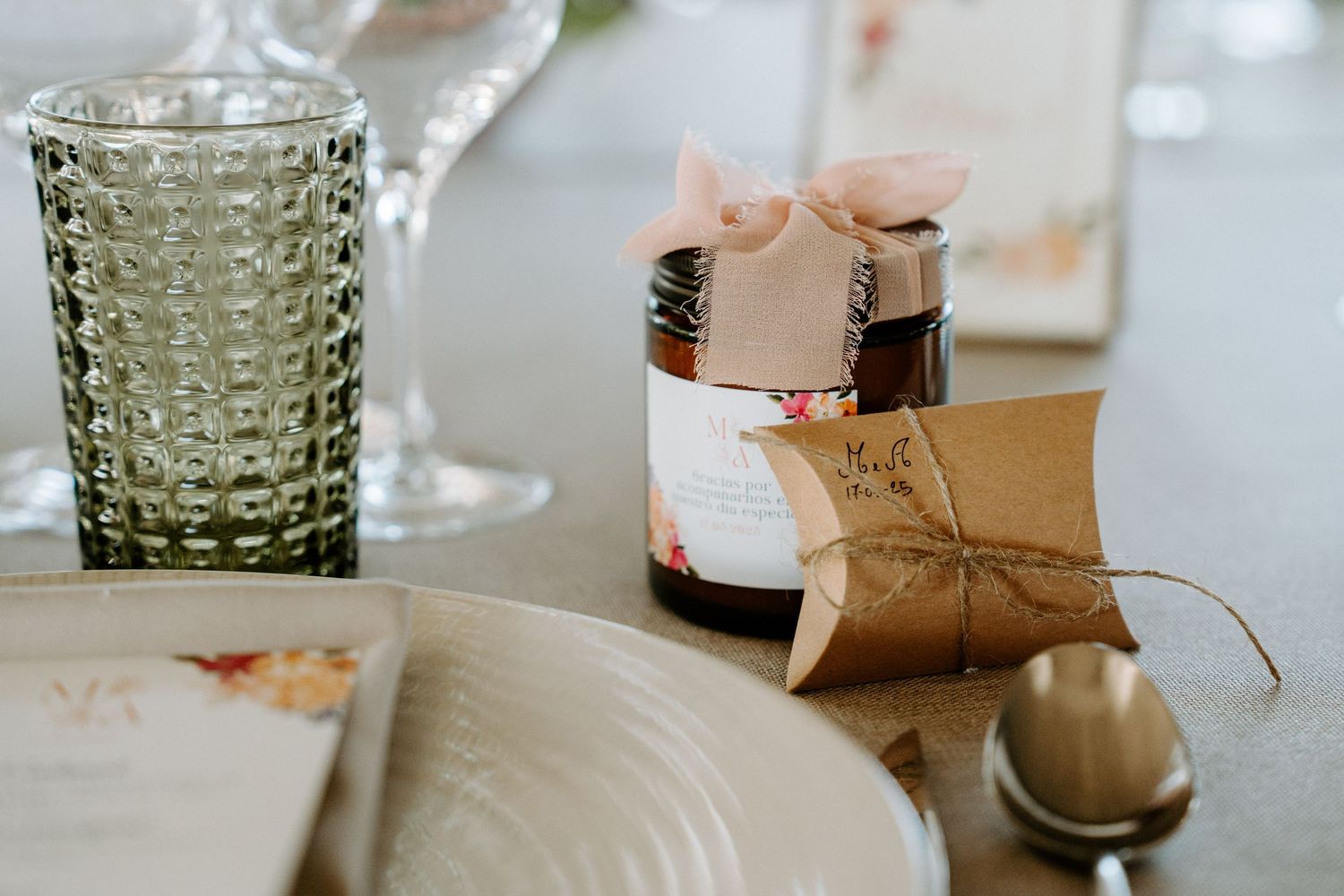 Elegant table settings with crystal glassware and delicate decorative details.