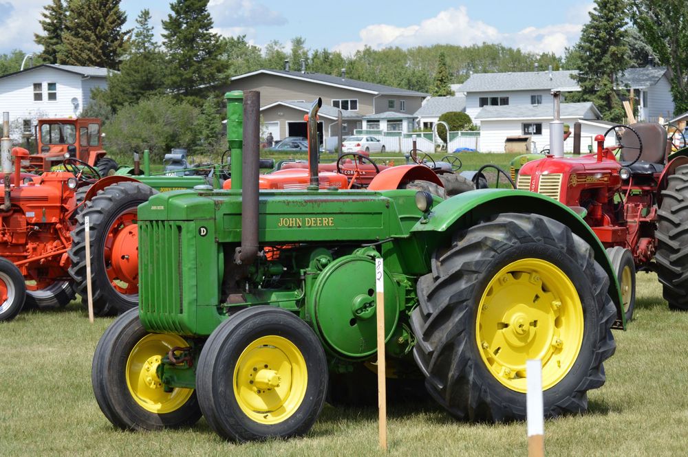 1950 John Deere waiting to compete in vintage tractor pulls at Lacombe historical museum.