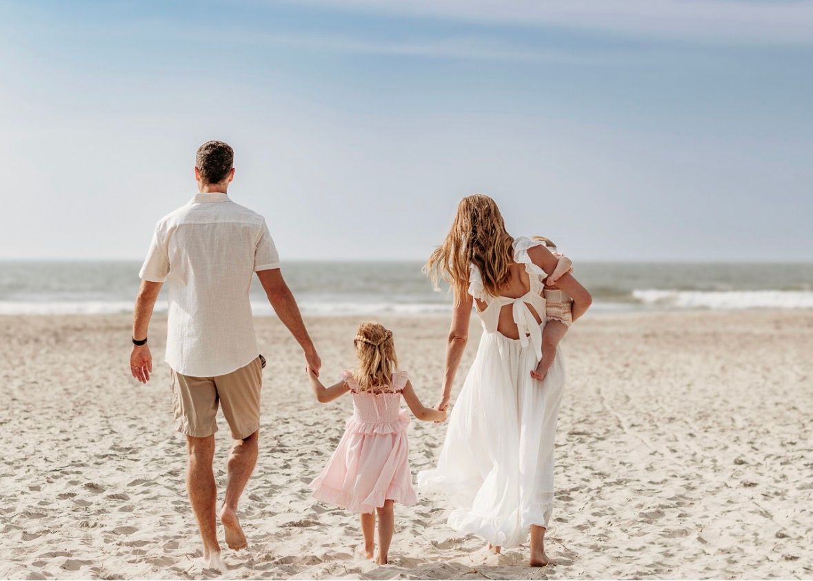 Family walking on the beach during a Ocean City, NJ family photography session