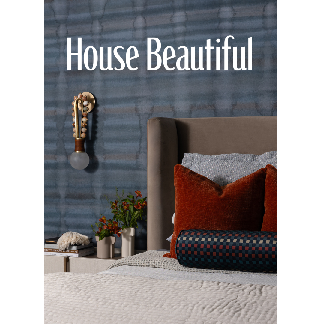 Heather Ison Photography for House Beautiful.  Featuring bedroom detail with blue wall and red accent pillow.