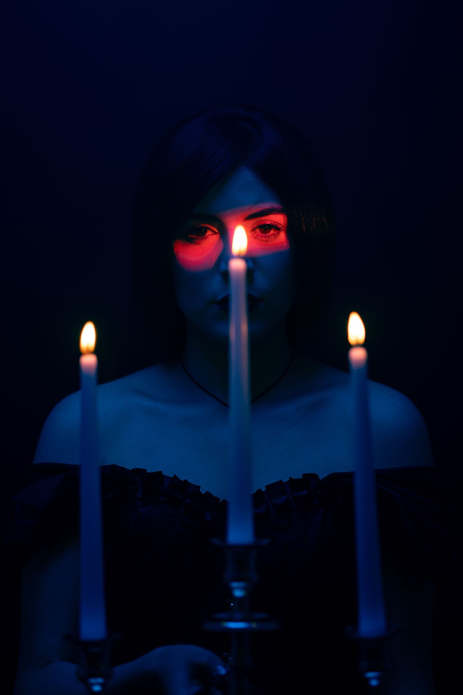 Mannyportraits editorial portrait – woman in dramatic red dress under cinematic lighting, Miami creative fashion photography.