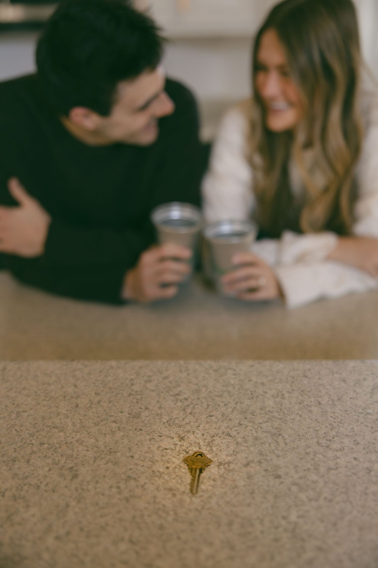 new home key couple celebrating realtor