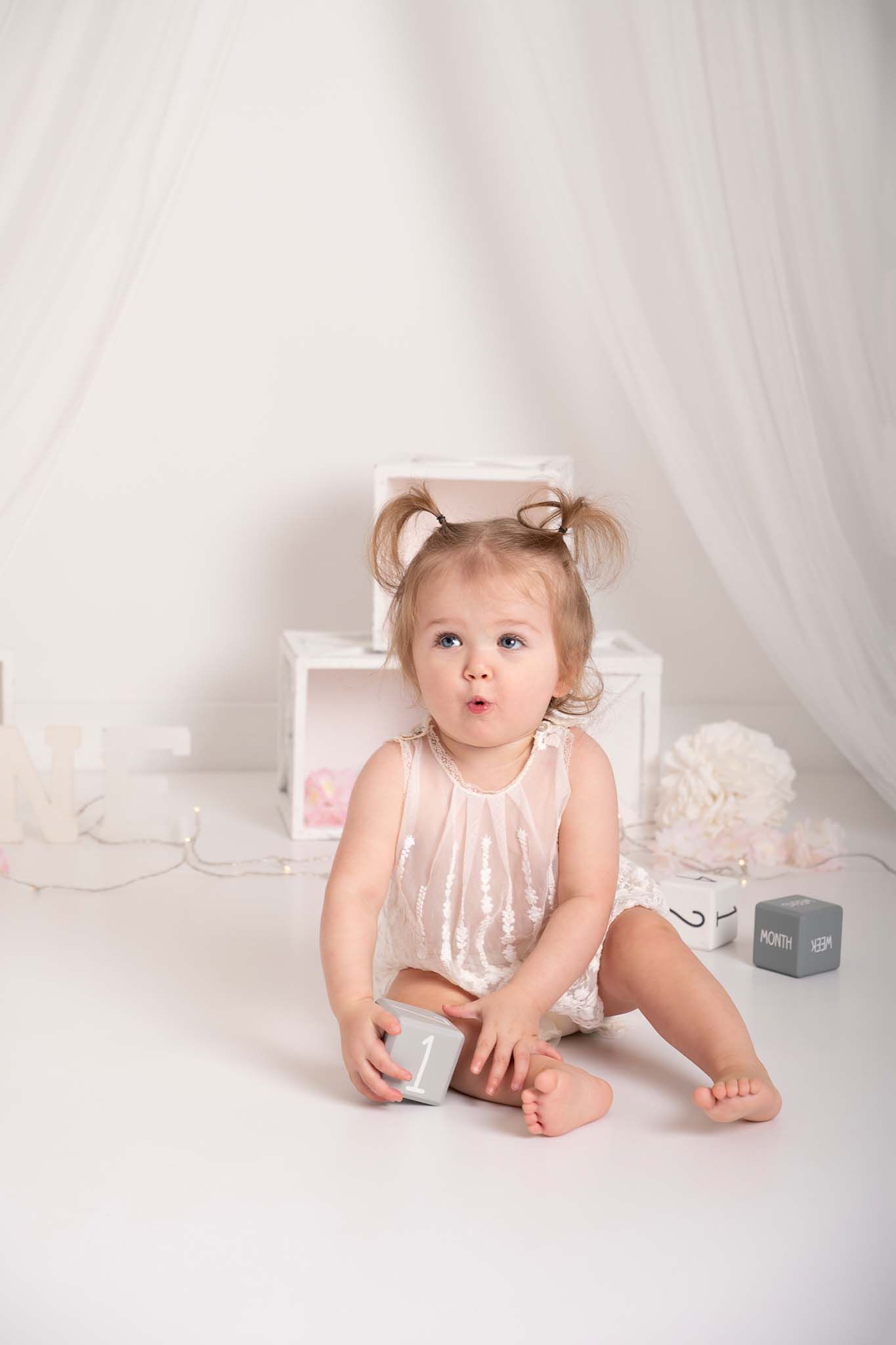 newborn baby girl, sleeping on tummy in pink blanket for her newborn baby photoshoot in Baltimore Ontario, 25 minutes from Newcastle*
