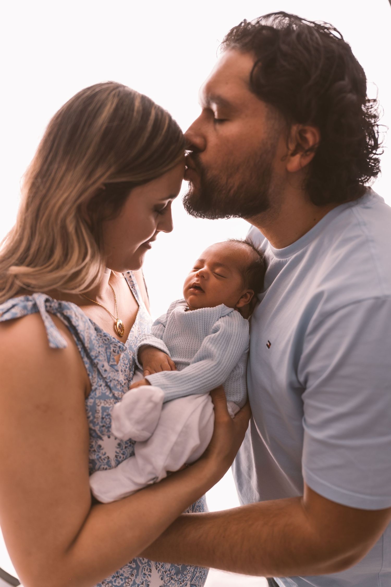 Family sharing loving embrace against white background.