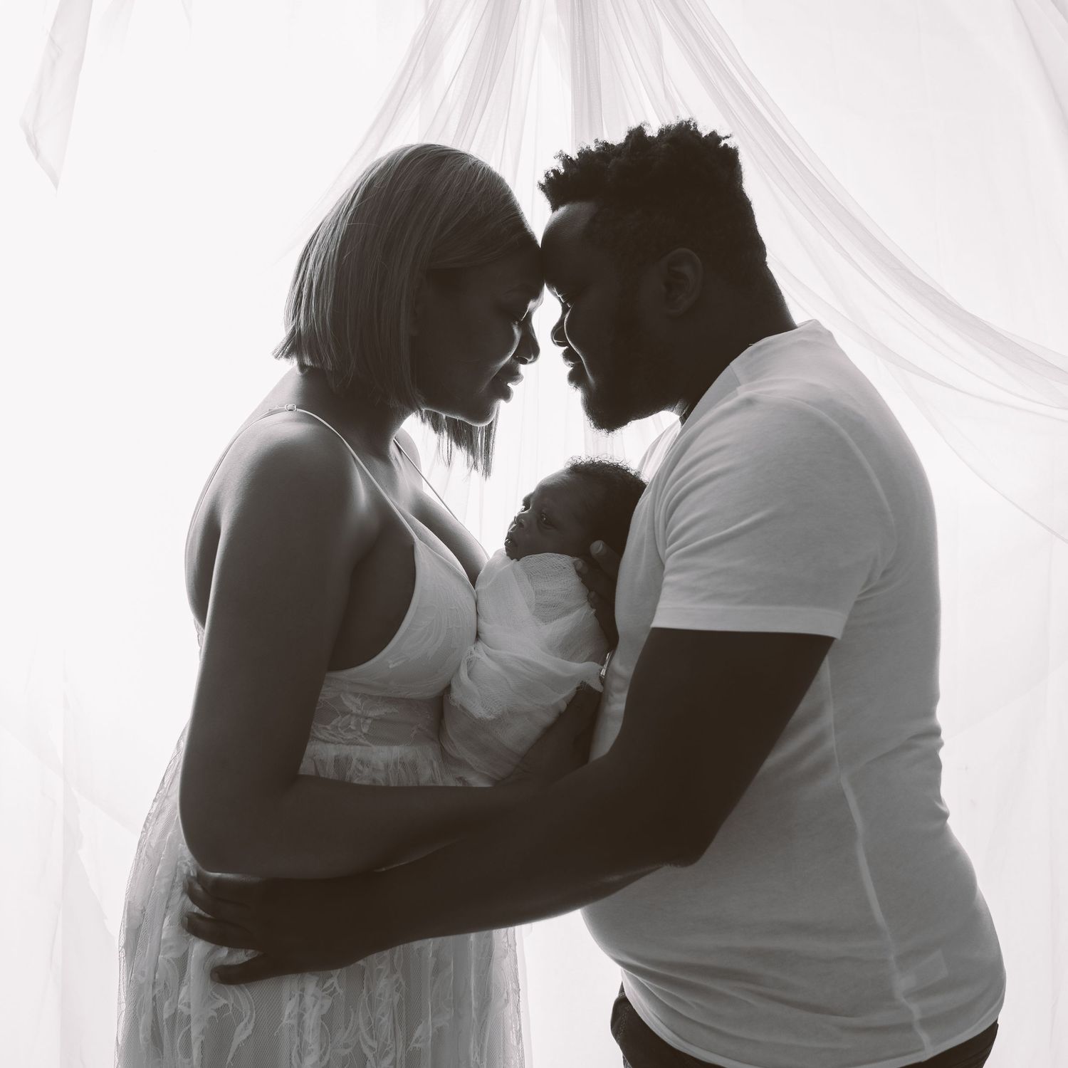 Series of tender black and white maternity photos showing loving couple moments.