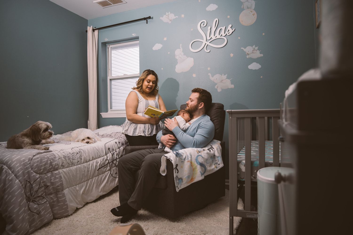 Quiet nursery scene with soft lighting and decorative wall elements.