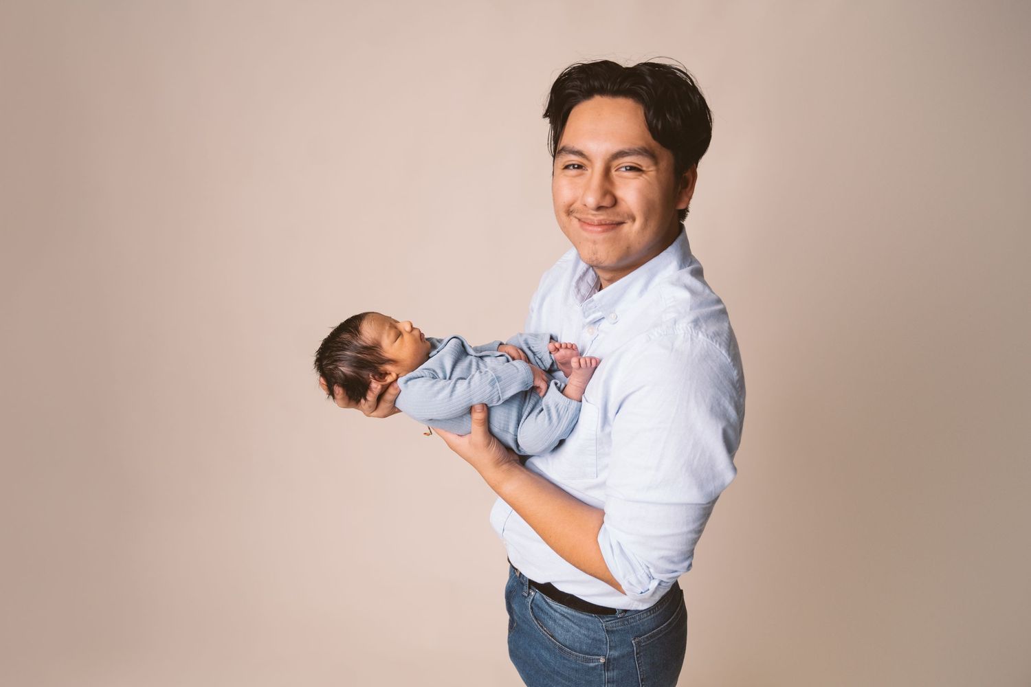 Series of tender poses showing love and connection with a baby in white and blue.
