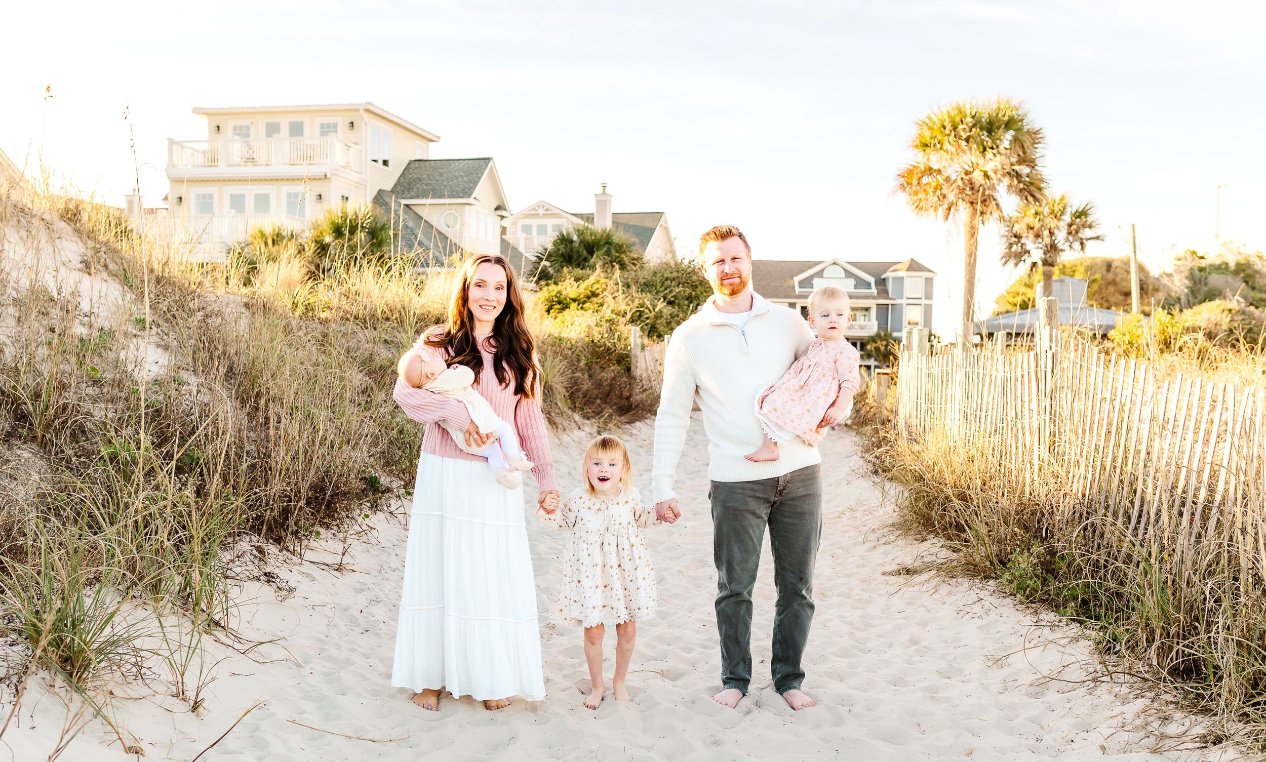Beach family photoshoot among sand dunes and sea oats at sunset. PRESLEY ROSE PHOTOGRAPHY OCEAN ISLE BEACH SUNSET BEACH BRUNSWICK BEACH OKI