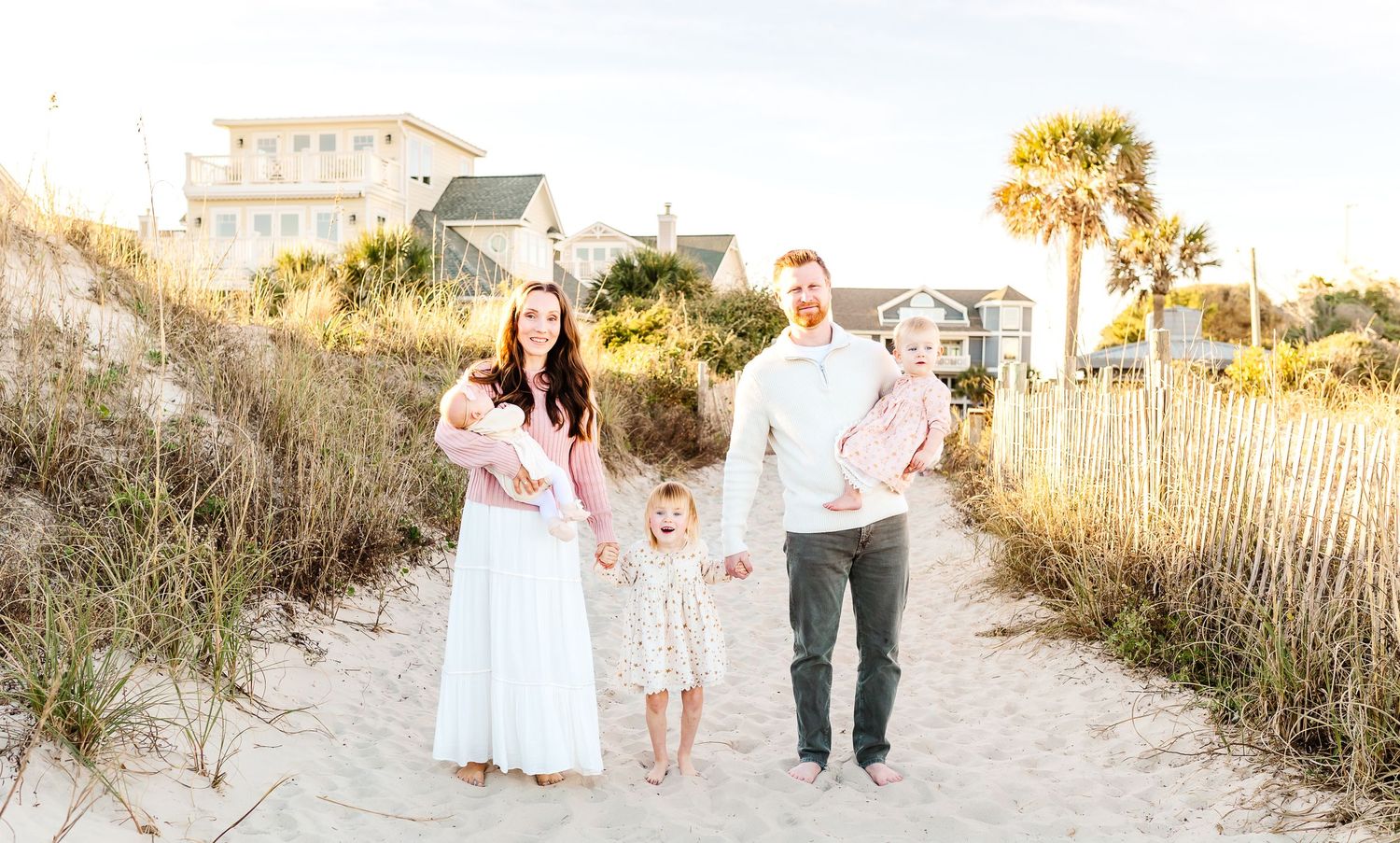 Beach family photoshoot among sand dunes and sea oats at sunset. PRESLEY ROSE PHOTOGRAPHY OCEAN ISLE BEACH SUNSET BEACH BRUNSWICK BEACH OKI