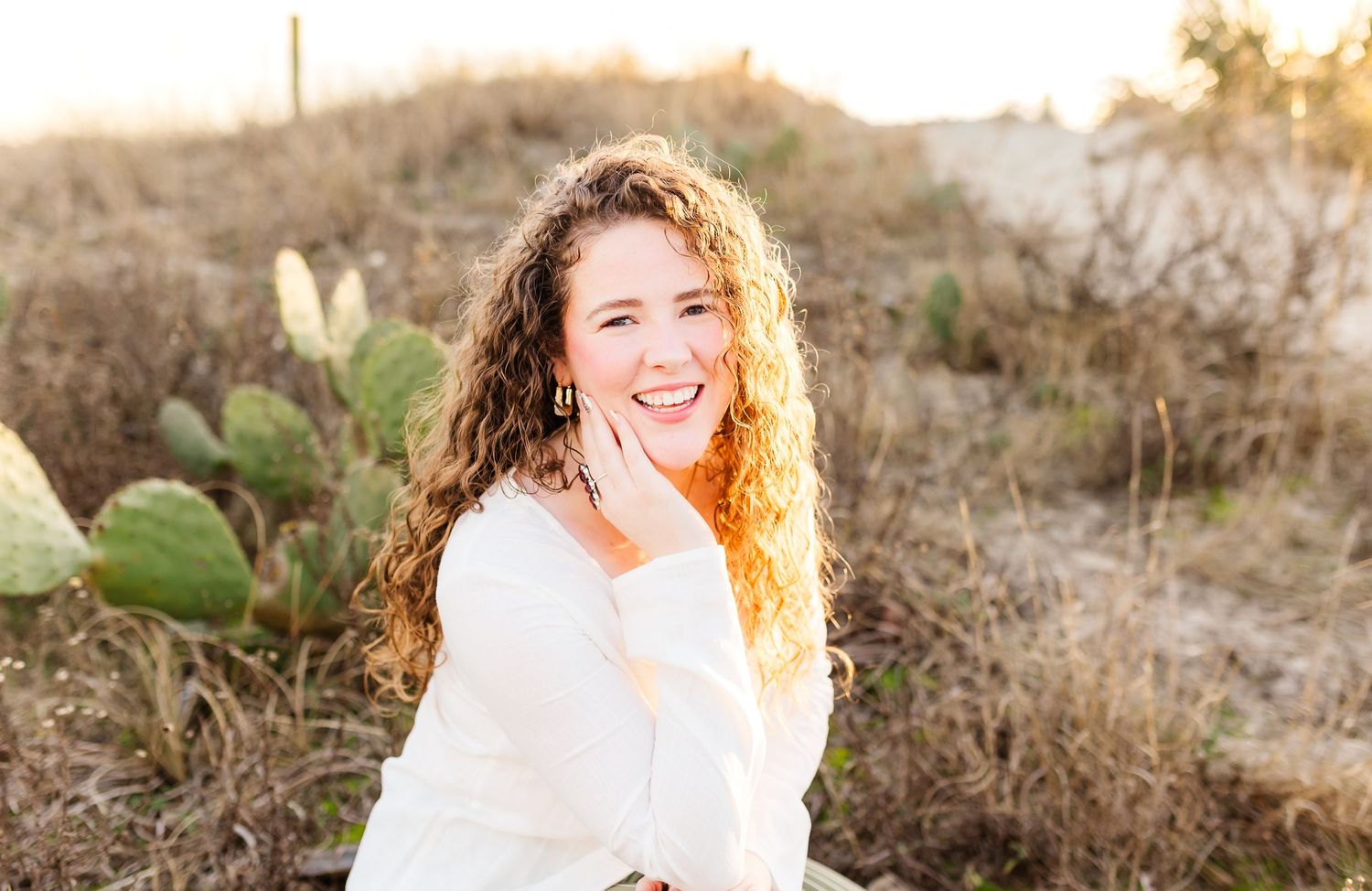 Candid outdoor photo session at sunset with natural desert brush and golden lighting. PRESLEY ROSE PHOTOGRAPHY OCEAN ISLE BEACH SUNSET BEACH