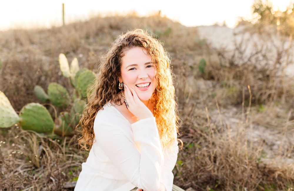 Candid outdoor photo session at sunset with natural desert brush and golden lighting. PRESLEY ROSE PHOTOGRAPHY OCEAN ISLE BEACH SUNSET BEACH