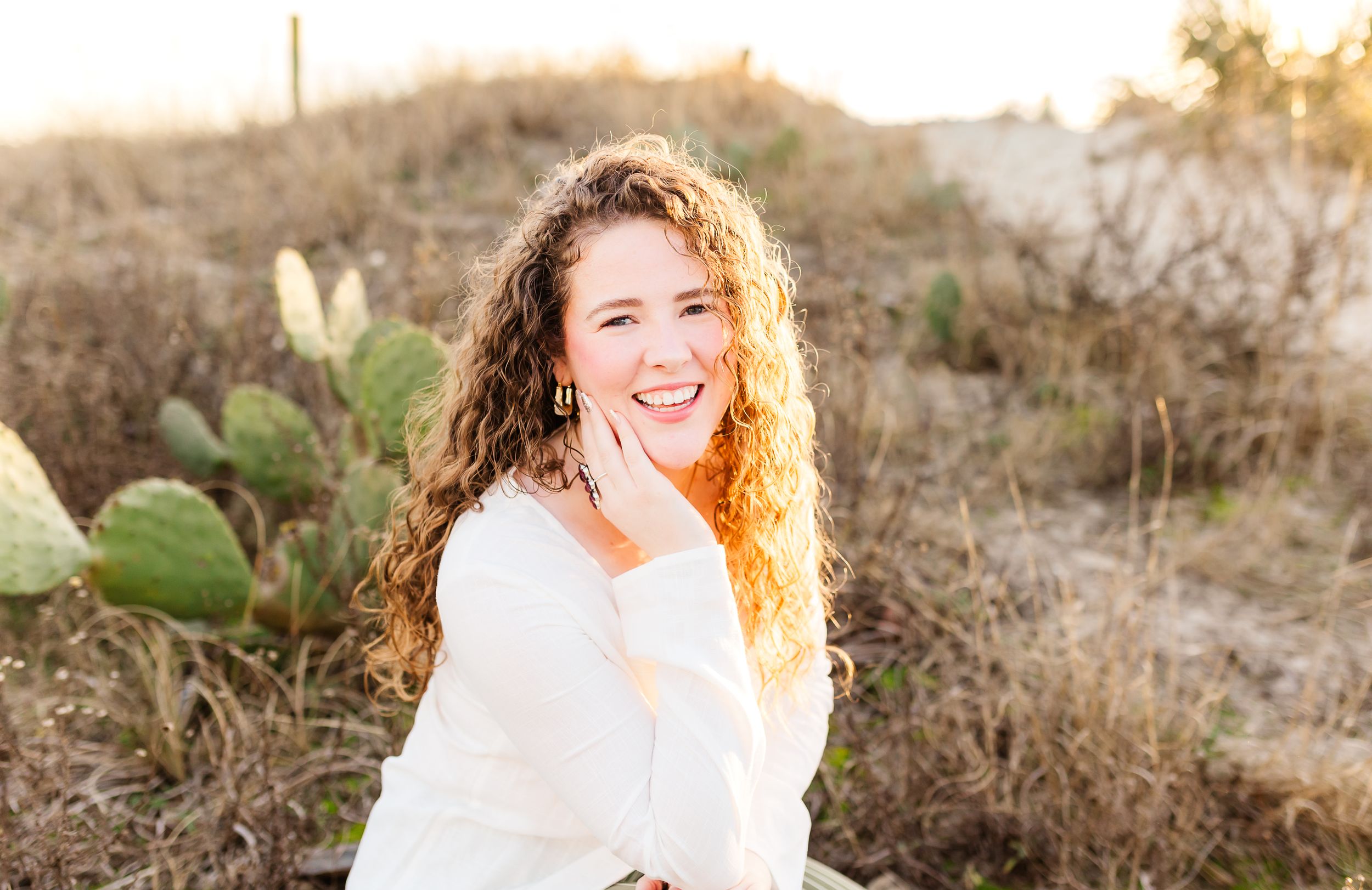 Candid outdoor photo session at sunset with natural desert brush and golden lighting. PRESLEY ROSE PHOTOGRAPHY OCEAN ISLE BEACH SUNSET BEACH