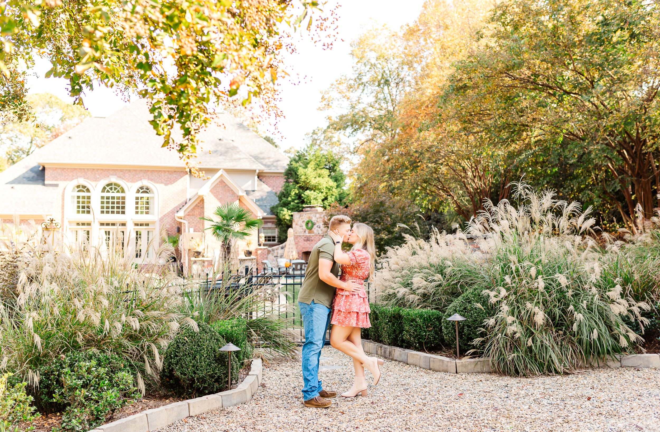 Family portrait session in a lush garden setting during golden hour. PRESLEY ROSE PHOTOGRAPHY OCEAN ISLE BEACH SUNSET BEACH BRUNSWICK BEACH