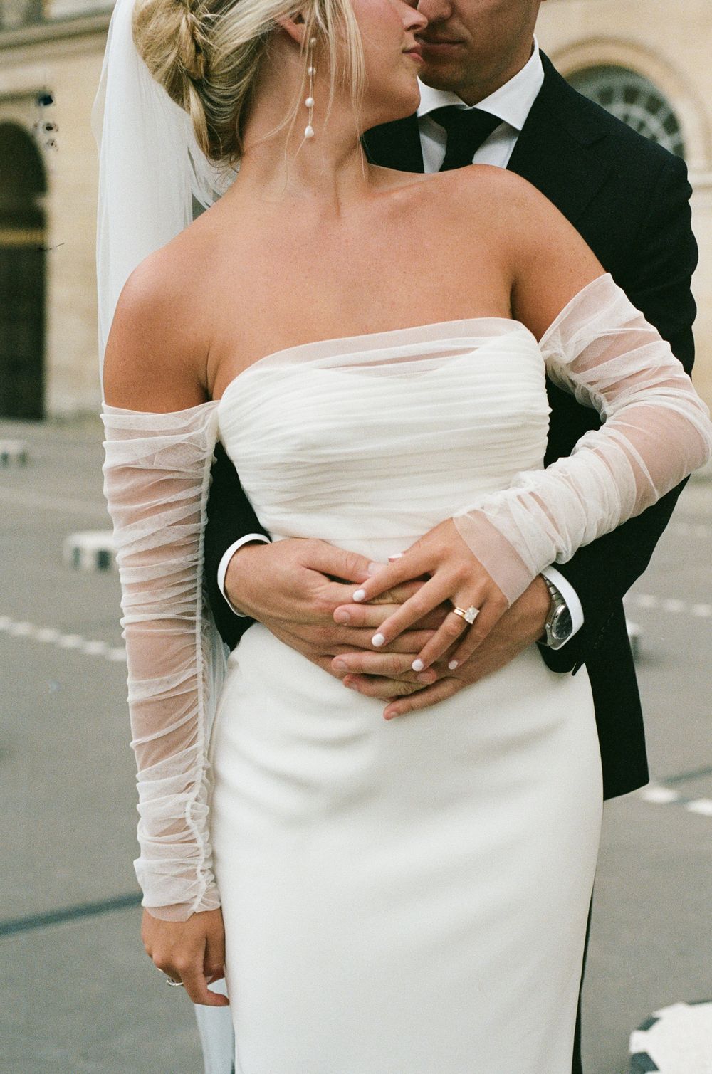 A series of romantic wedding photos showing close-up details of a bride in an off-shoulder white dress. Paris editorial elopement photograph