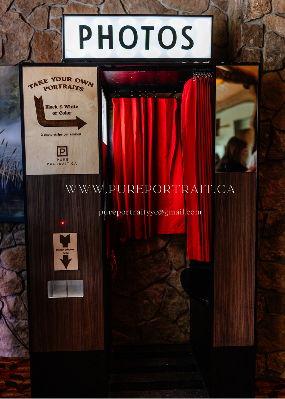 A series of dark wooden photo booth kiosks with red curtains and Pure Portrait signage against a stone wall.