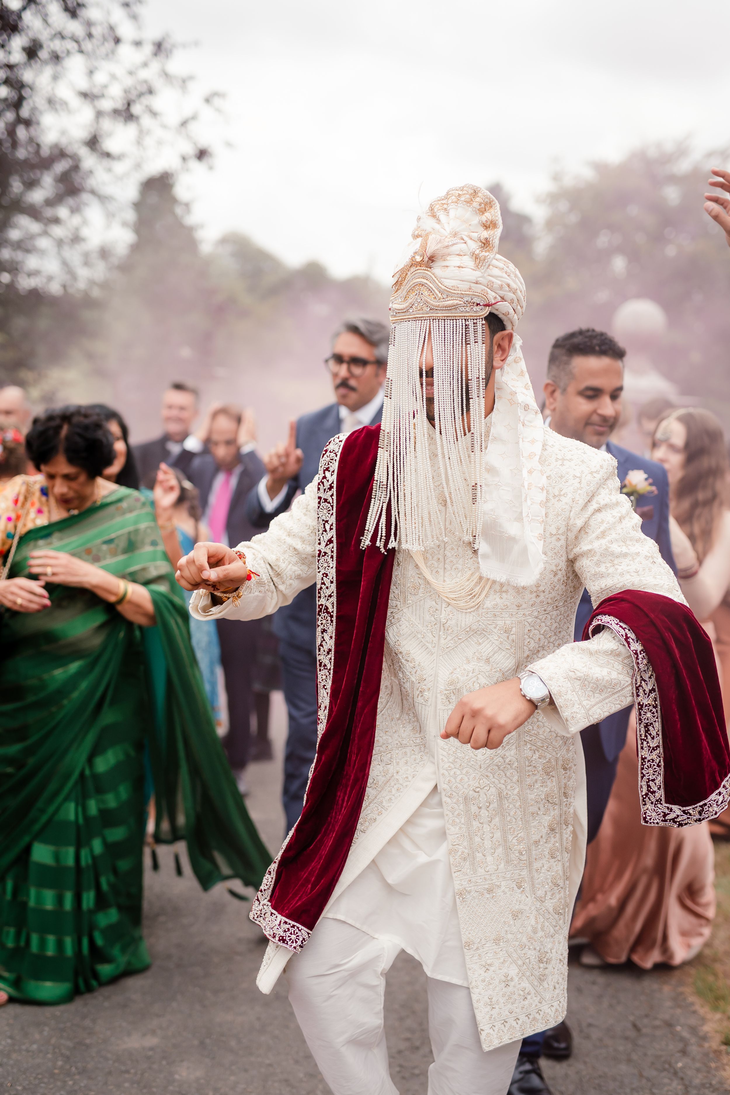 Fusion wedding reception décor at Bredenbury Court Barns with vibrant Indian colours and elegant British styling