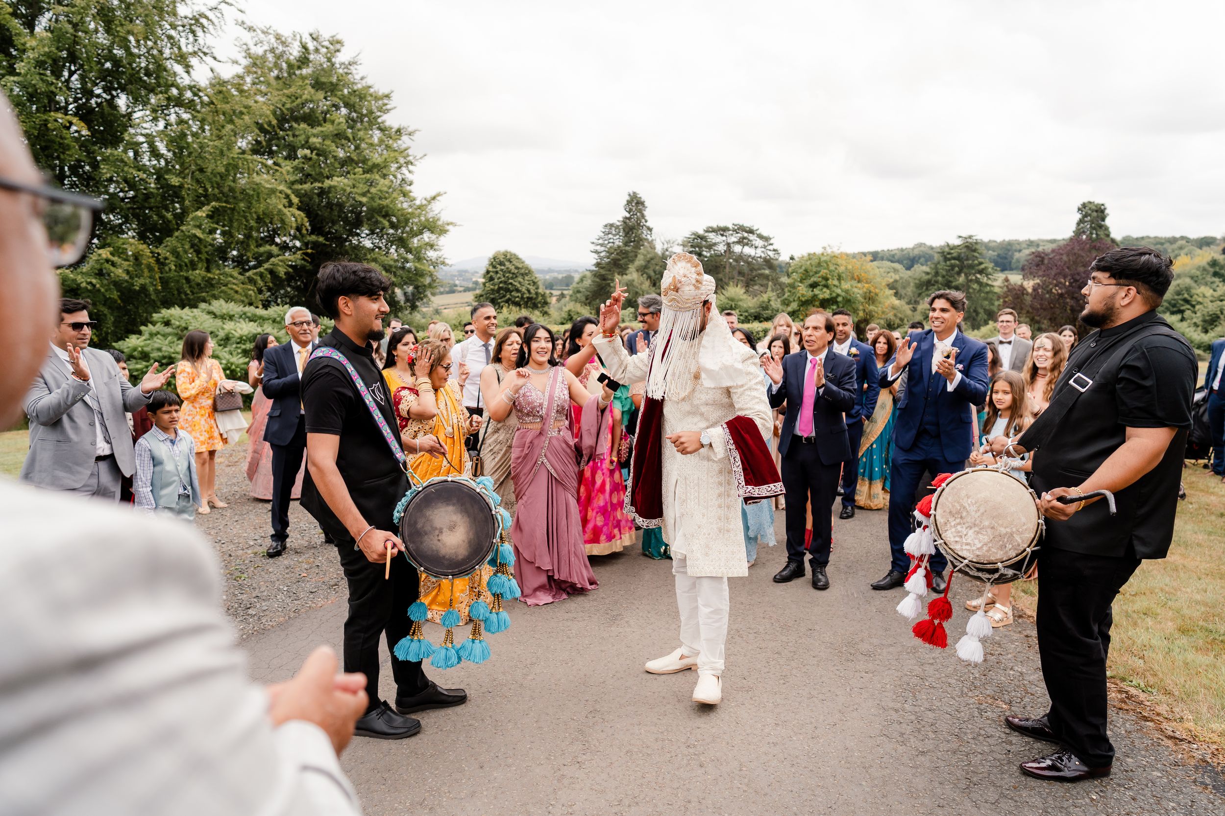 Fusion wedding reception décor at Bredenbury Court Barns with vibrant Indian colours and elegant British styling