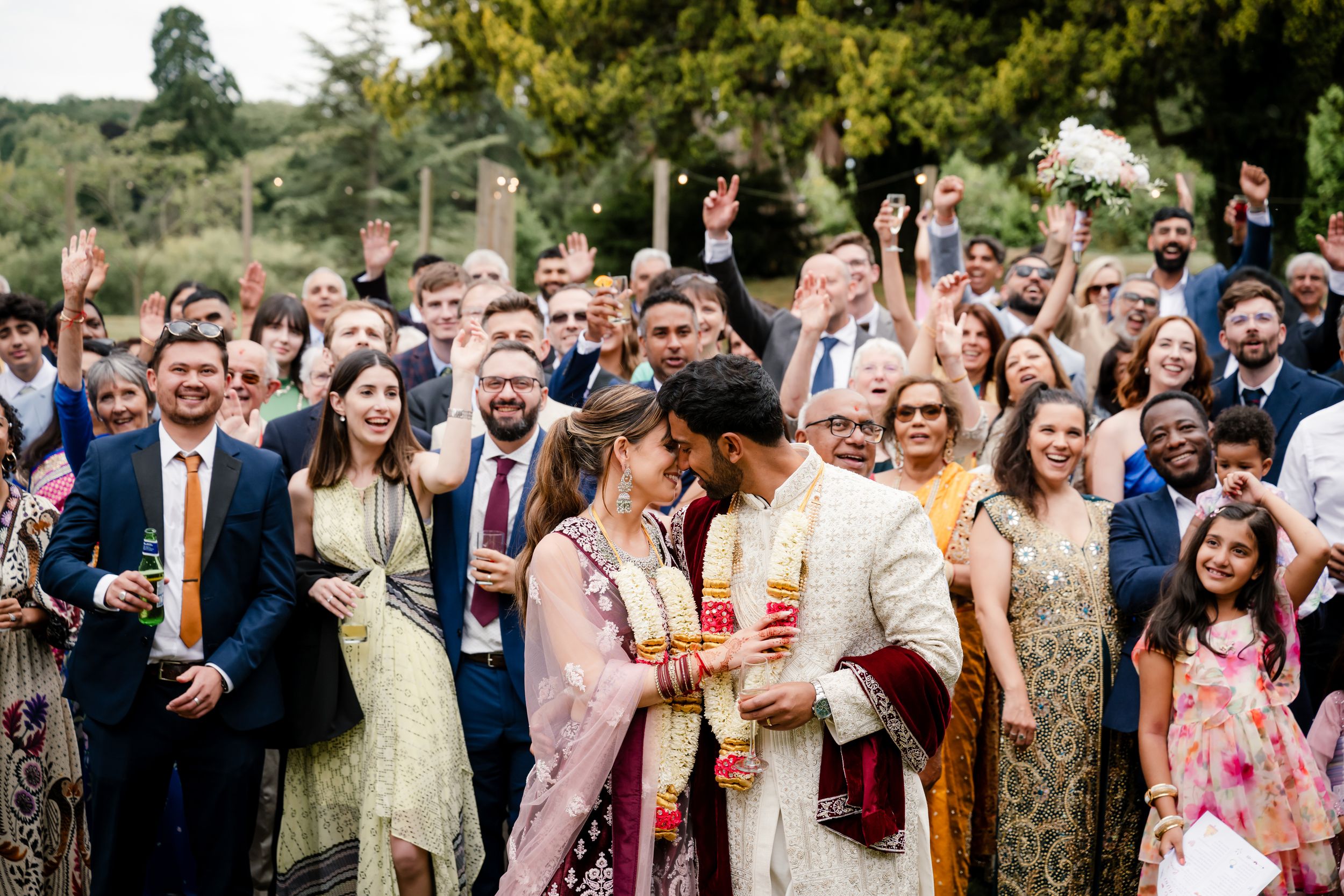 Fusion wedding reception décor at Bredenbury Court Barns with vibrant Indian colours and elegant British styling