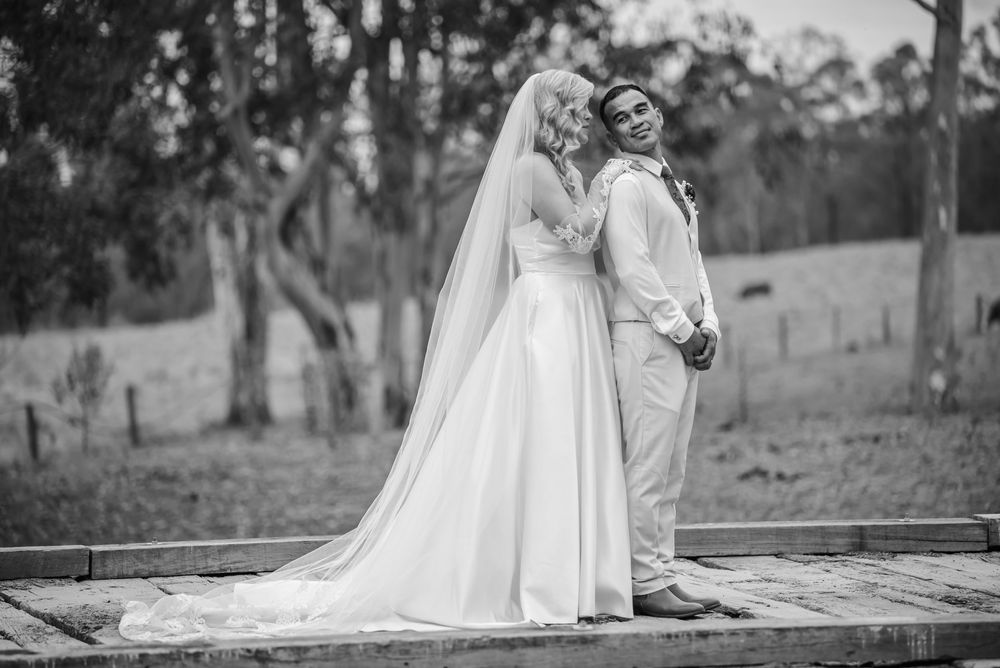 Black and white wedding photography session in a natural outdoor setting.