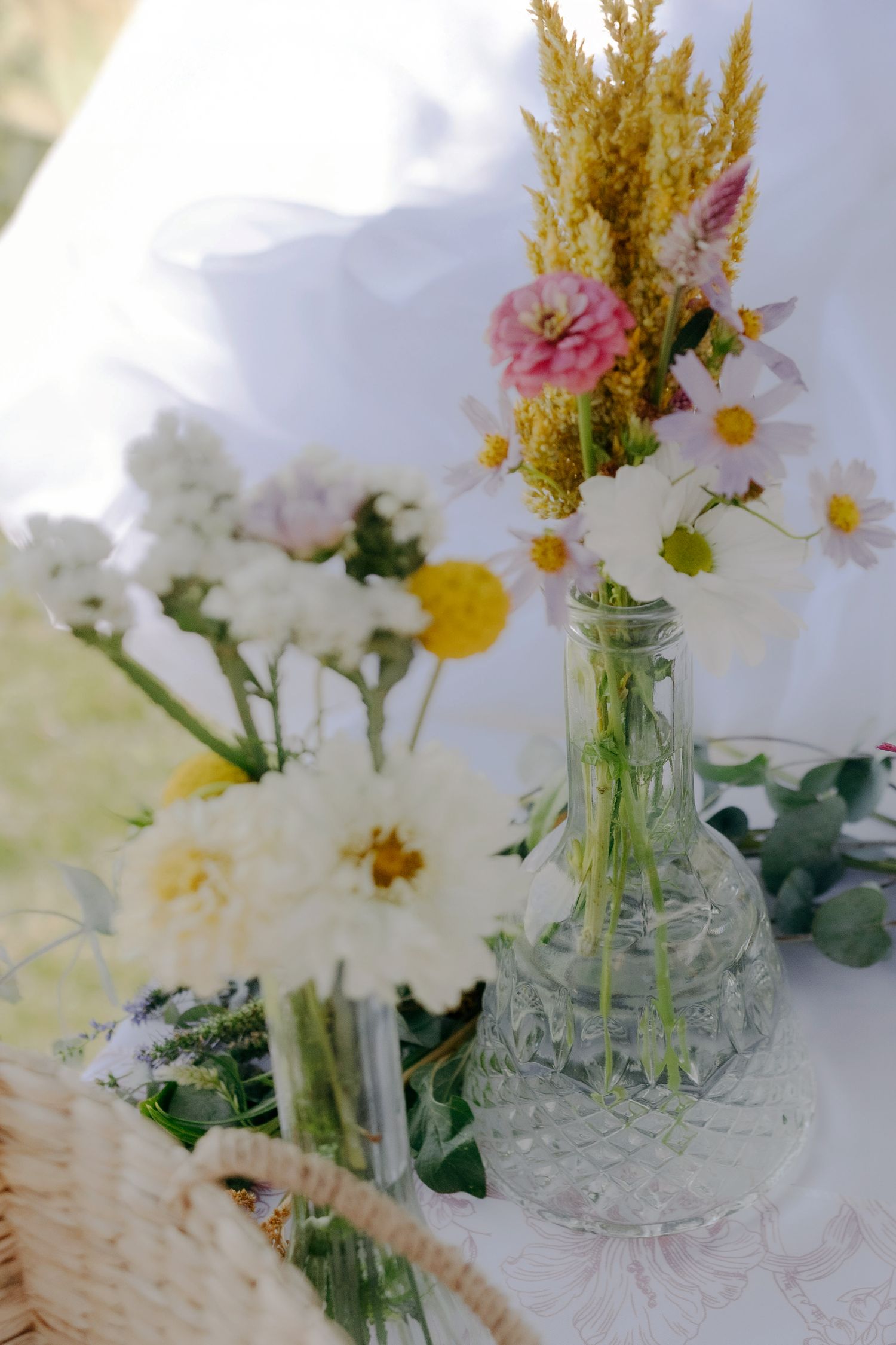 Wild flowers in vases table decor. Boise wedding florals. Milestones wedding planning, Boise wedding planner.