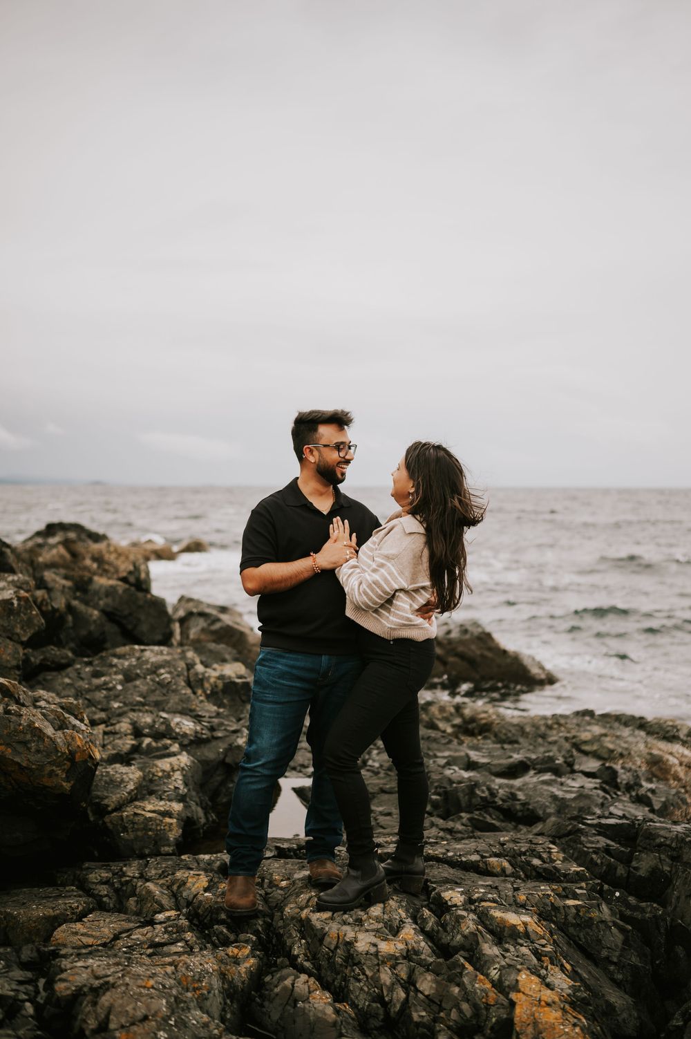 Neck Point Park, Nanaimo, Vancouver Island Engagement Photographer Photoshoot of couple holding each other in the rain